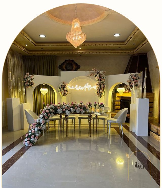 White arches and pink florals with an illuminated Mawaddah wa Rahmah sign — Zaina Events Abu Dhabi