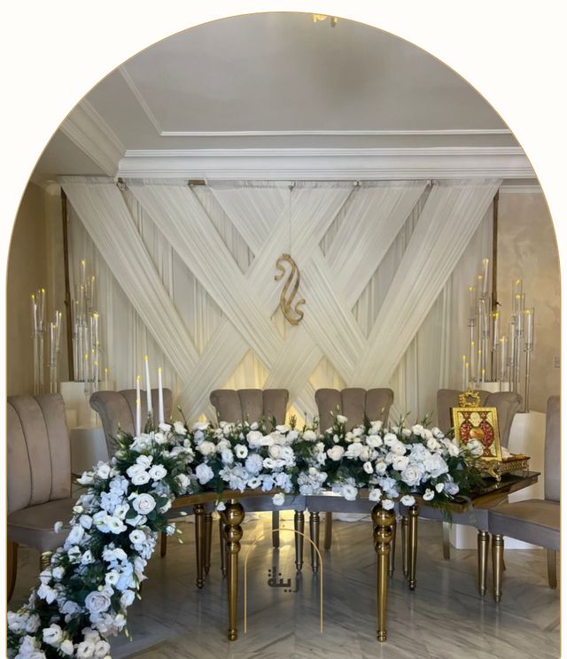 Head table with white florals, candelabras and a gold monogram — Zaina Events Abu Dhabi