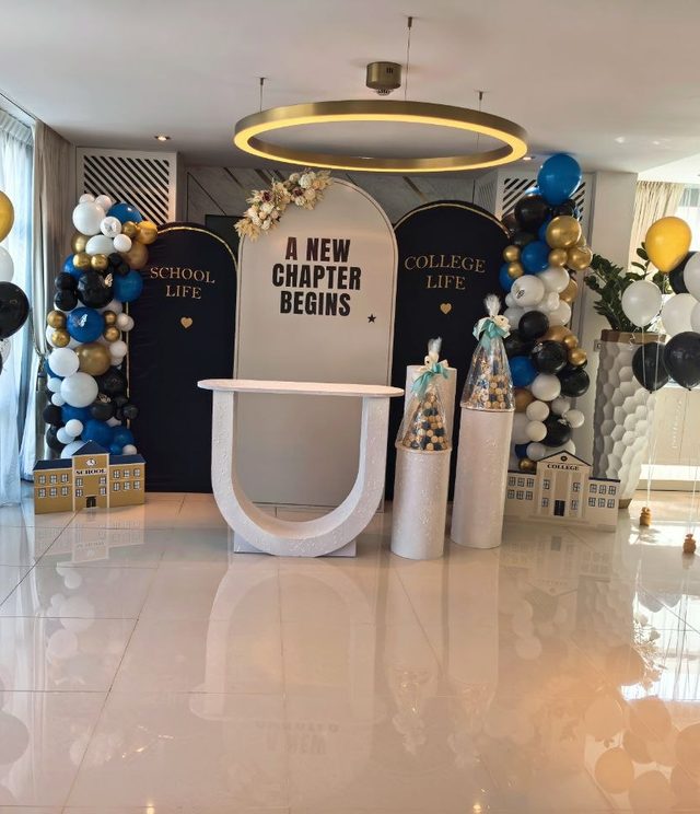 Wide view of the college send-off setup reflected on the marble floor — Zaina Events Abu Dhabi