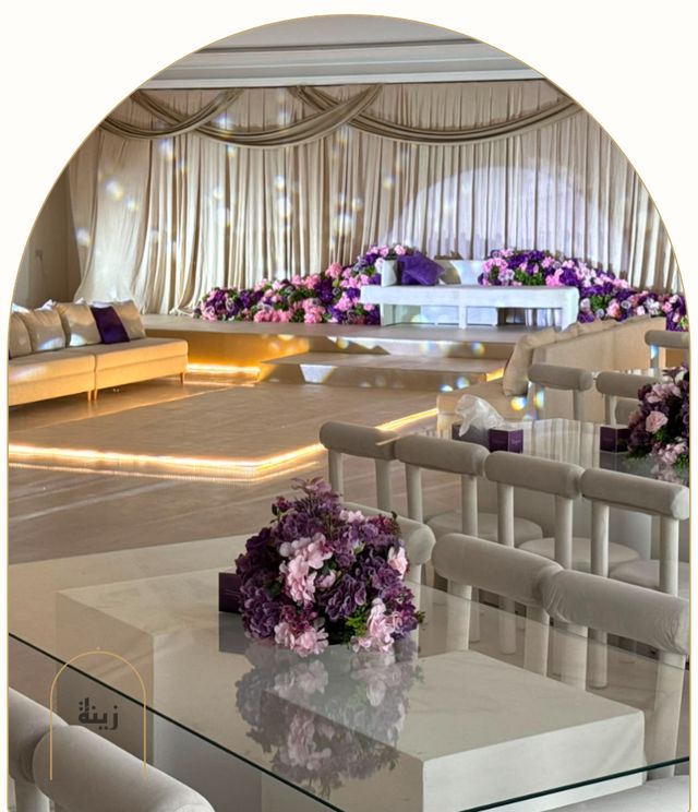 Wedding hall styled in lilac with golden lighting — Zaina Events Abu Dhabi